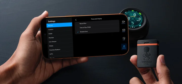 Phone displaying Blackmagic Camera timecode options beside a sync device